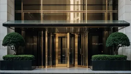 Elegant condo entrance with greenery